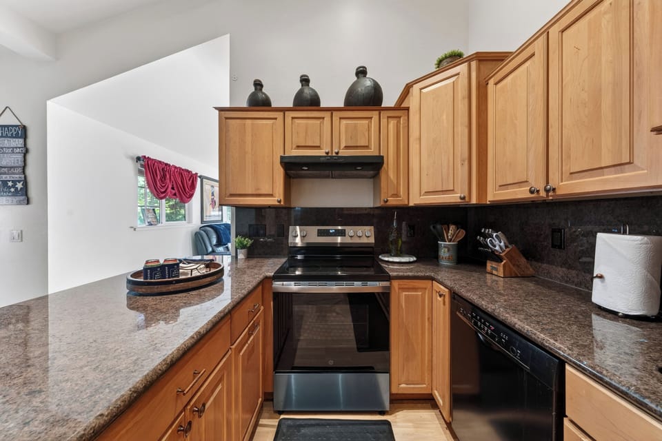 Fully equipped kitchen with island seating and easy flow into the main living area. 