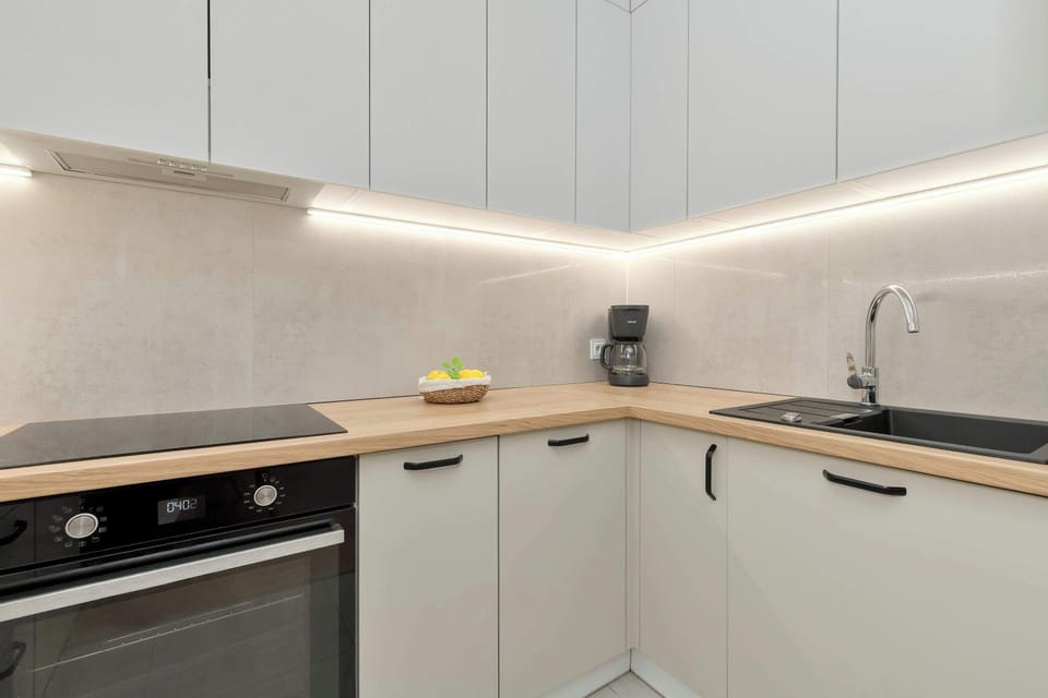 The fully equipped kitchenette includes everything you need for a home-cooked meal.