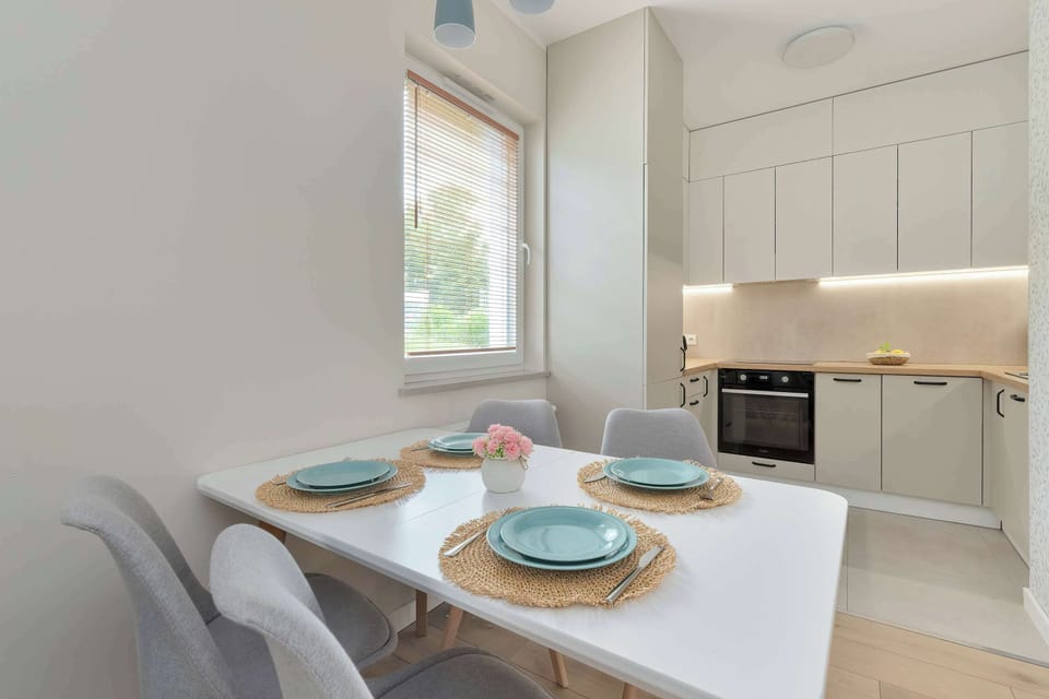 The sleek design of the kitchenette blending seamlessly with the living area.