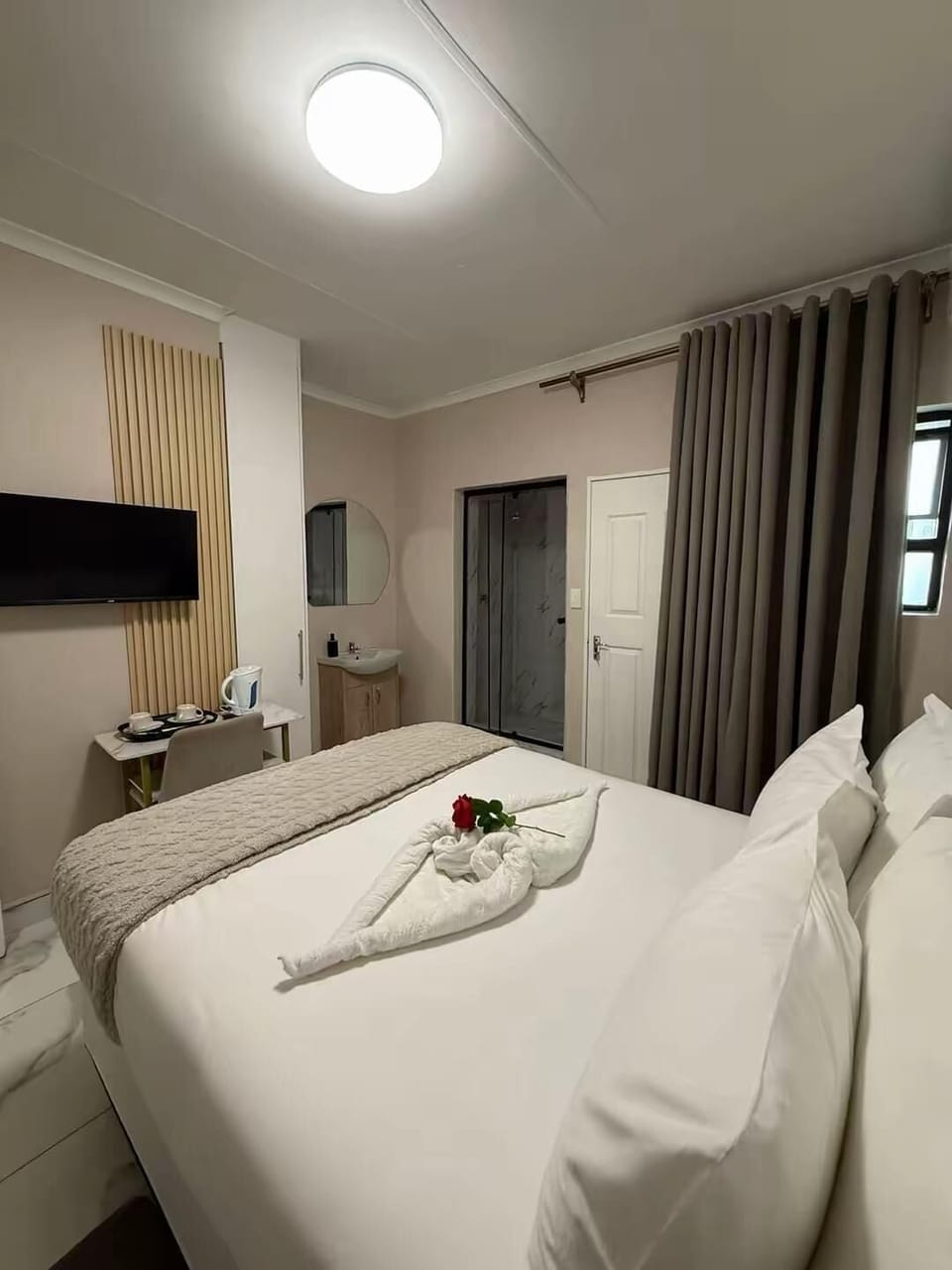 Premium bedding, desk, laptop workspace, iron/ironing board