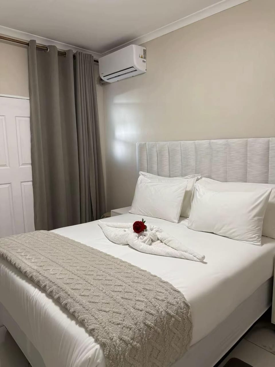 Premium bedding, desk, laptop workspace, iron/ironing board