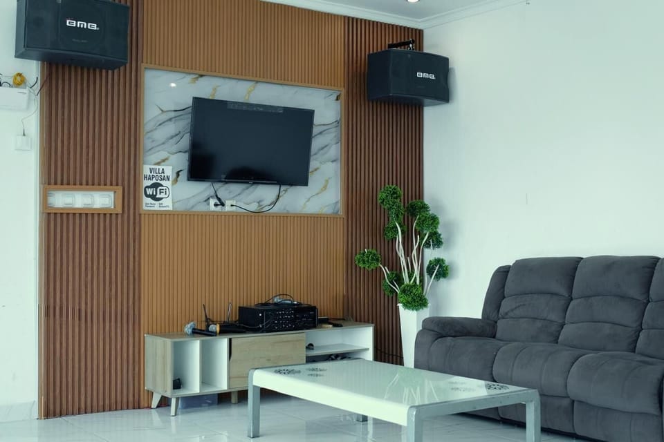 Deluxe Villa, 4 Bedrooms | Living area | Foosball