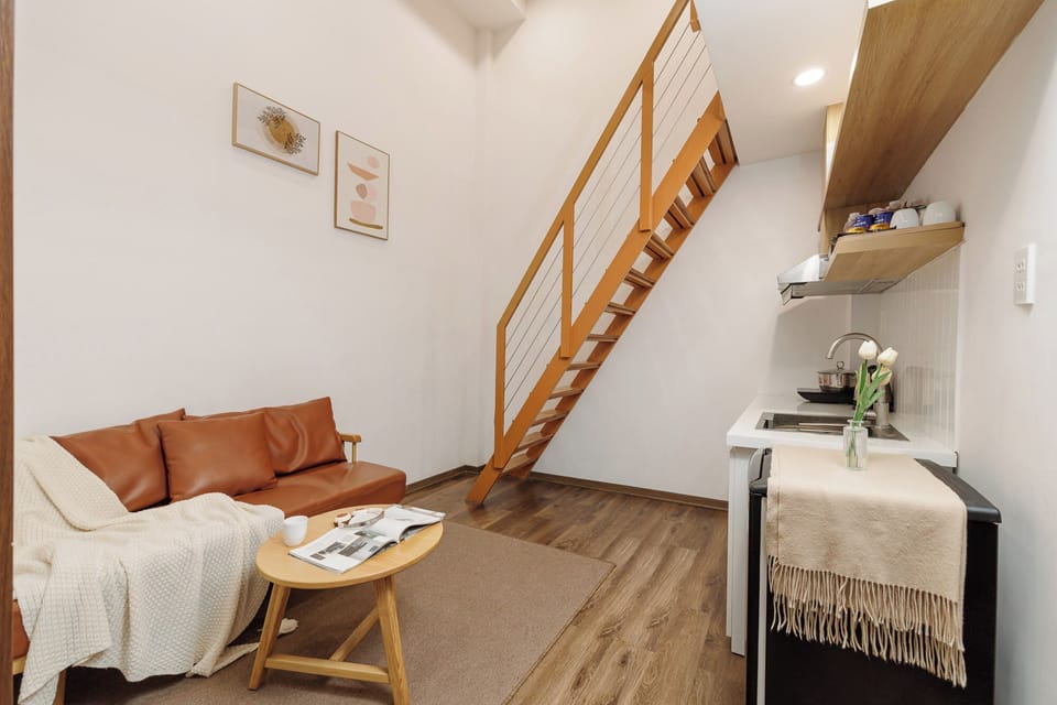 Deluxe Loft, 2 Bedrooms | Living area | 41-inch Smart TV with cable channels