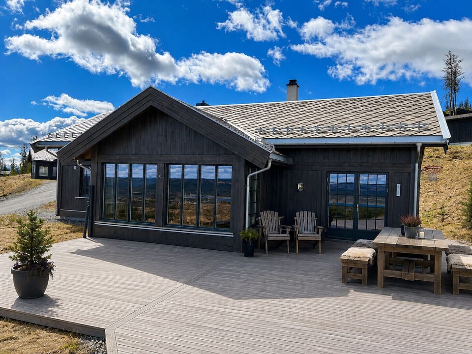At the front of the cabin there is a large terrace with furniture