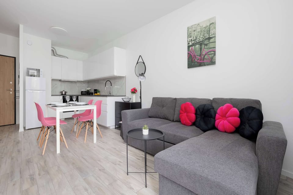 Bright open-plan living space combining the lounge, dining area, and kitchenette.