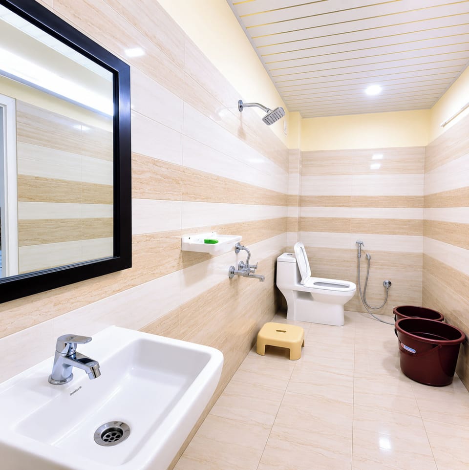 Shower, rainfall showerhead, slippers, towels