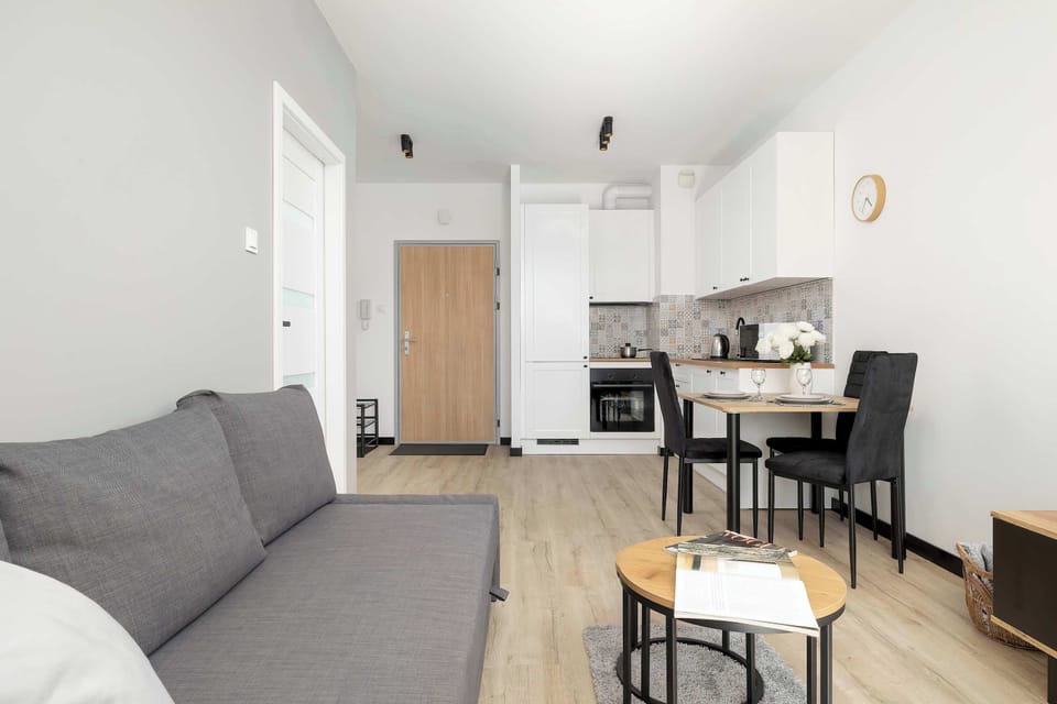 Open-plan living area connecting the lounge, dining space and kitchen