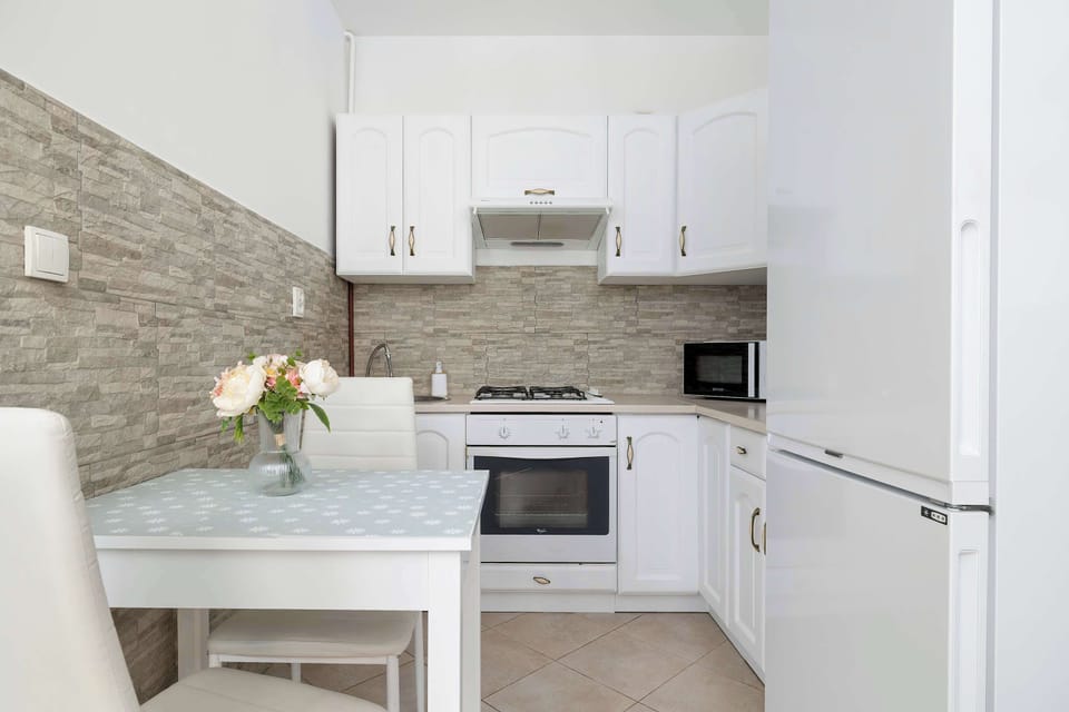 The fully equipped kitchenette includes everything you need for a home-cooked meal.