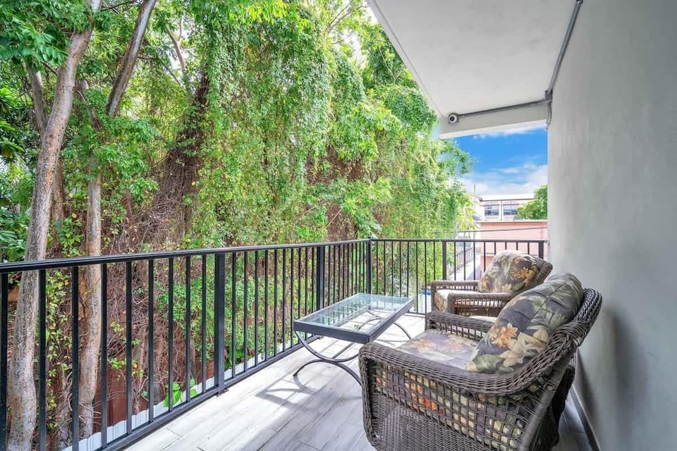 Relax on the balcony surrounded by greenery, perfect for morning coffee or unwinding in the evening.