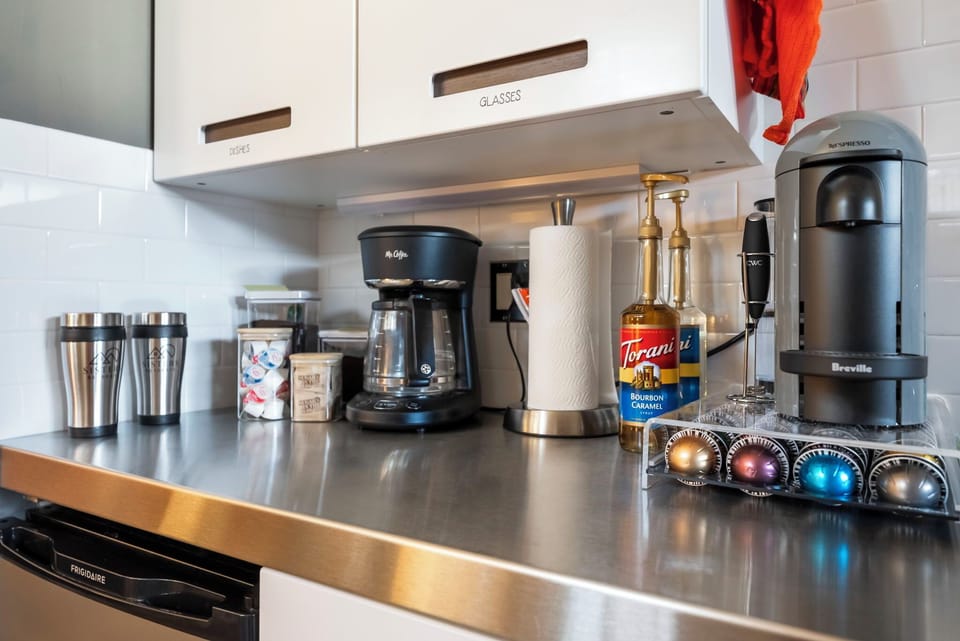Your fully-equipped kitchen features a Nespresso machine, drip coffee maker, and premium accessories—everything you need to start mornings at your own pace.