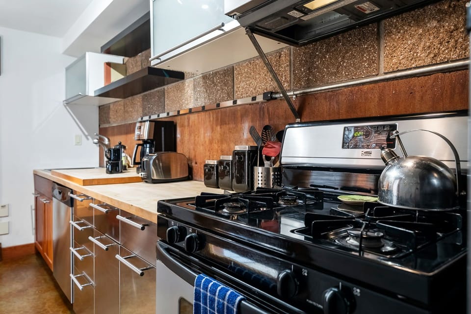Your fully equipped kitchen awaits, complete with stove, modern appliances, and everything you need to prepare delicious meals during your stay.