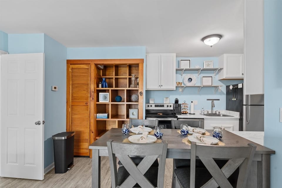 The dedicated dining space offers a stylish, cozy layout right next to the kitchen prep area.