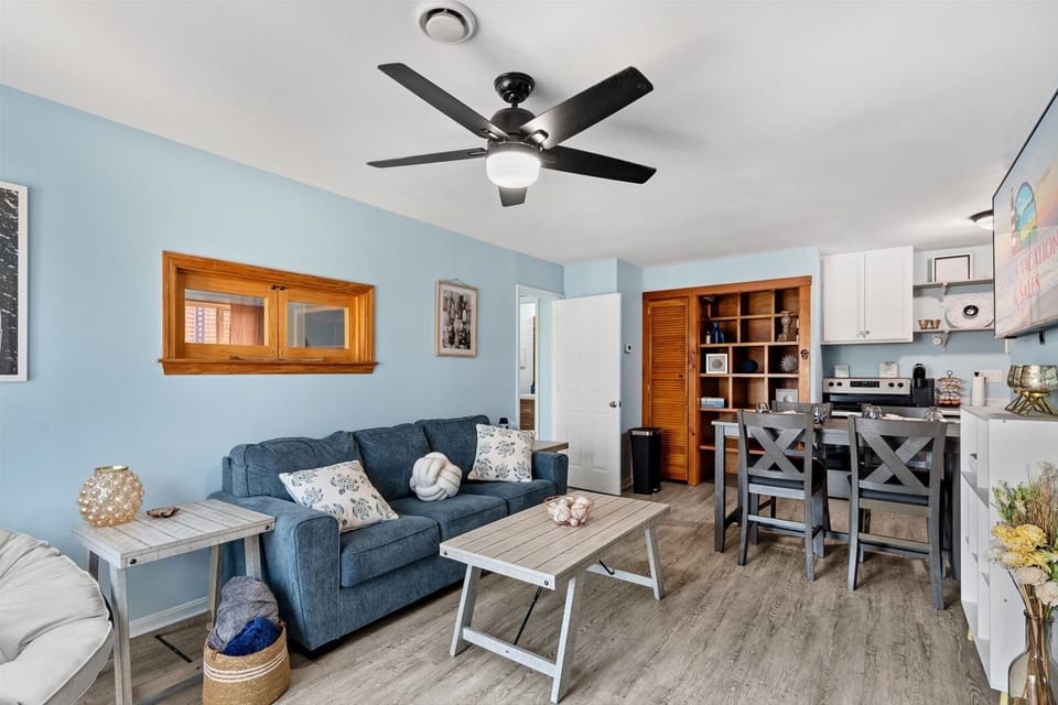 An alternative look at the open-concept design, highlighting the ample seating and warm wood decor accents.