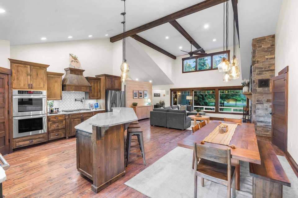 Plenty of space for breakfast, meal prep, and conversation around the expansive gathering island.