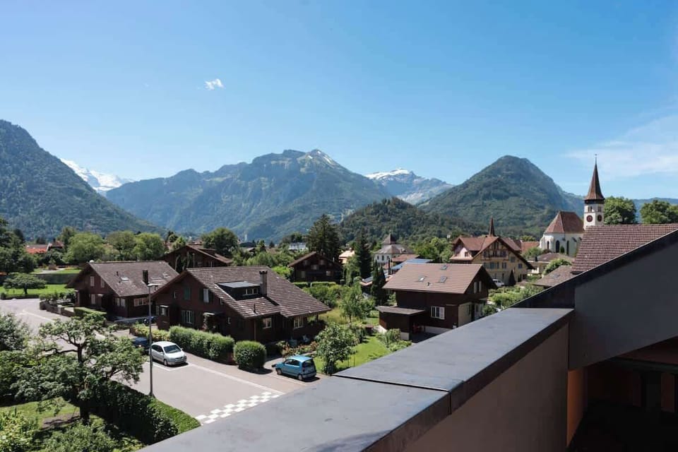 Mountain and village view from the balcony, ideal for enjoying the peaceful alpine surroundings.