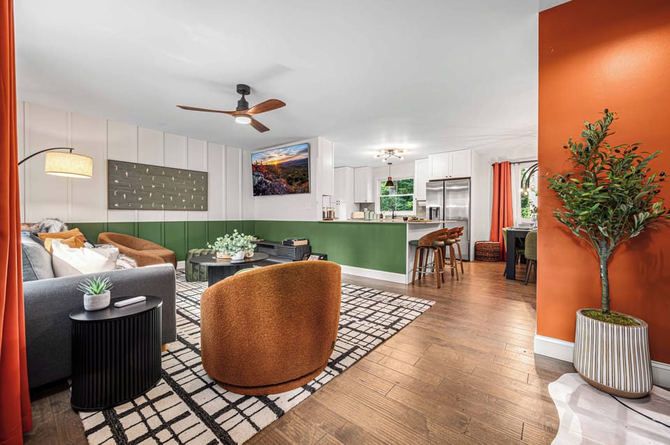 Bright open-concept living space with chic seating and kitchen bar