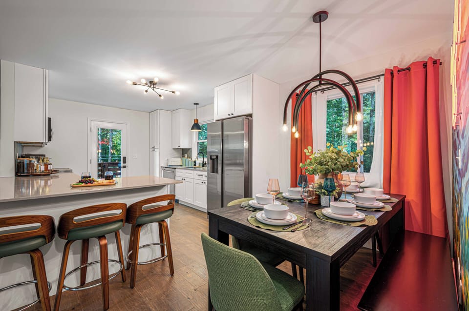 Bright open kitchen and dining space with island seating and stylish decor