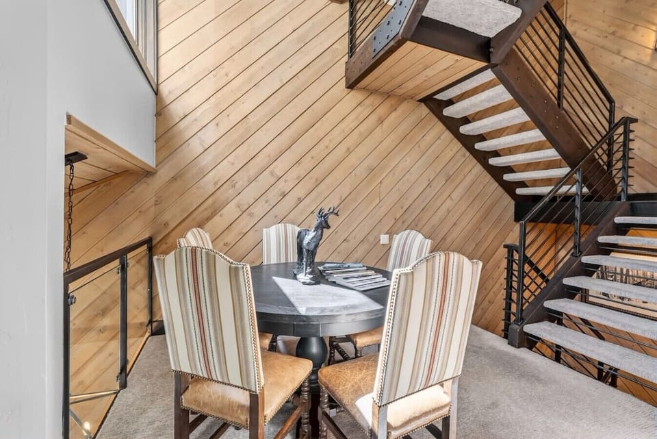 Spacious living room with vaulted ceilings, fireplace, and smart tv