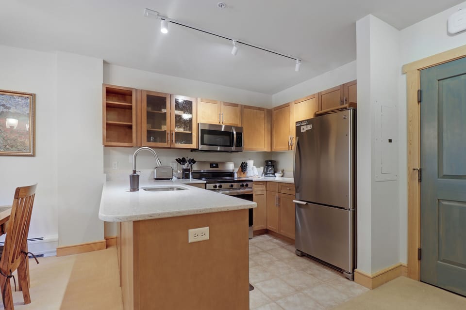 Your fully equipped kitchen awaits with modern appliances, ample counter space, and everything you need to prepare your favorite meals in comfort and style.