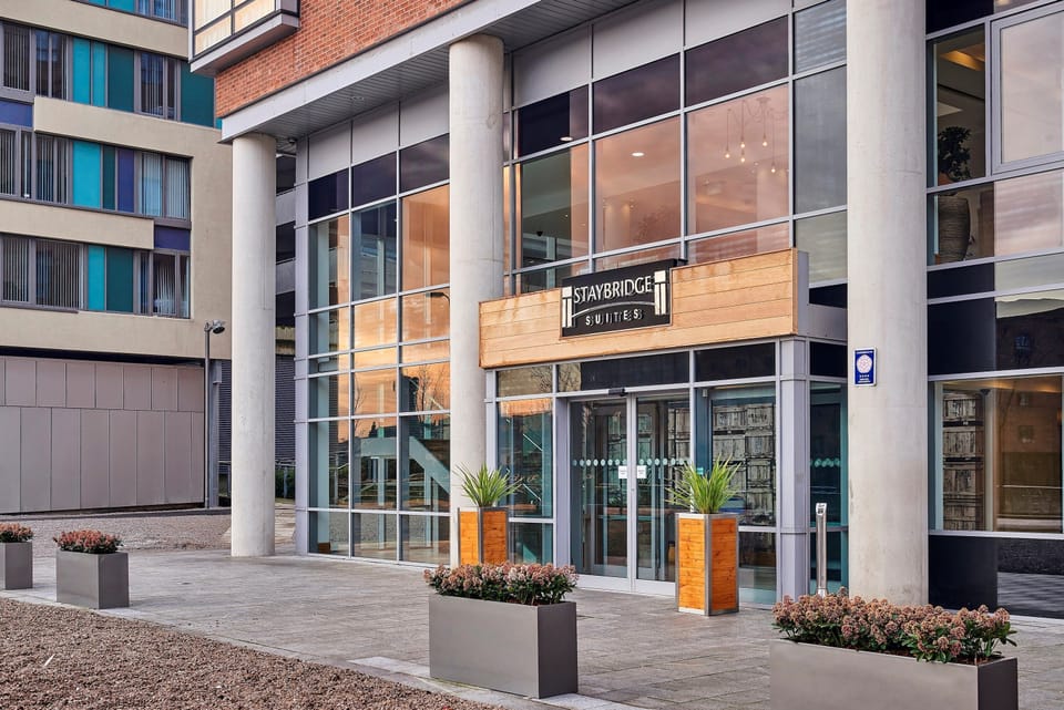 Modern hotel building exterior with clean architectural design.