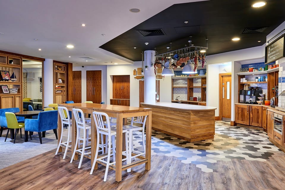 Bright communal space with unique seating and inviting decor.