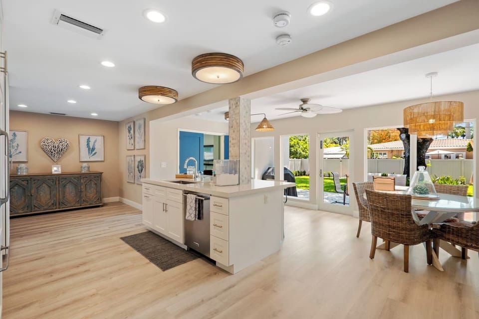 Open kitchen and dining with French doors out to the patio.