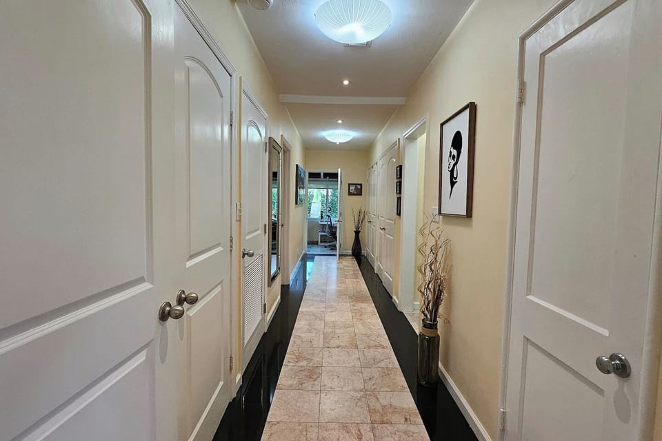 Hallway leading to the bedrooms and bathrooms.