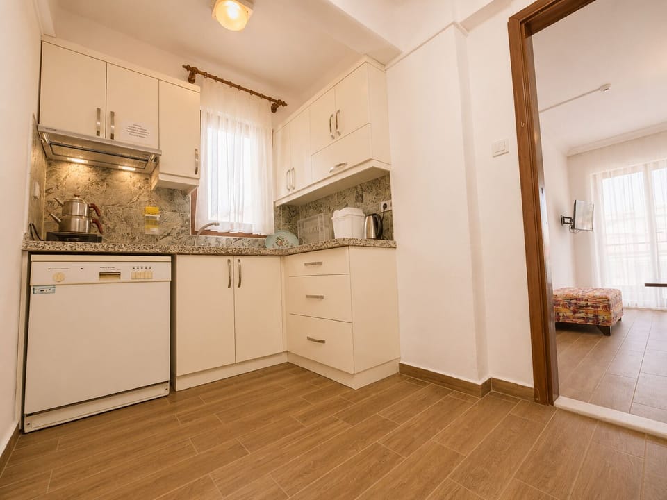 Family Quadruple Room, Beach View, Beachside | Private kitchen | Mini-fridge