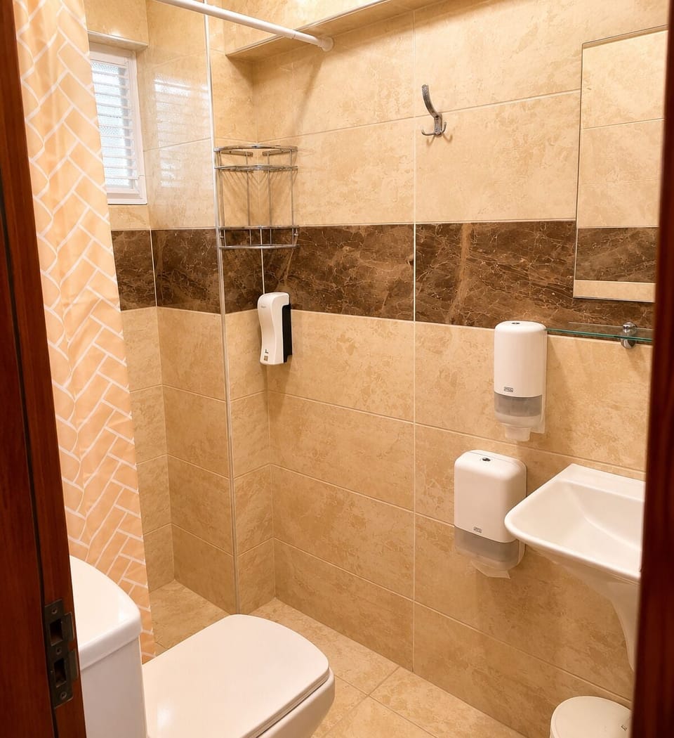 Economy Double Room, Balcony, Partial Sea View | Bathroom | Shower, towels, soap, shampoo