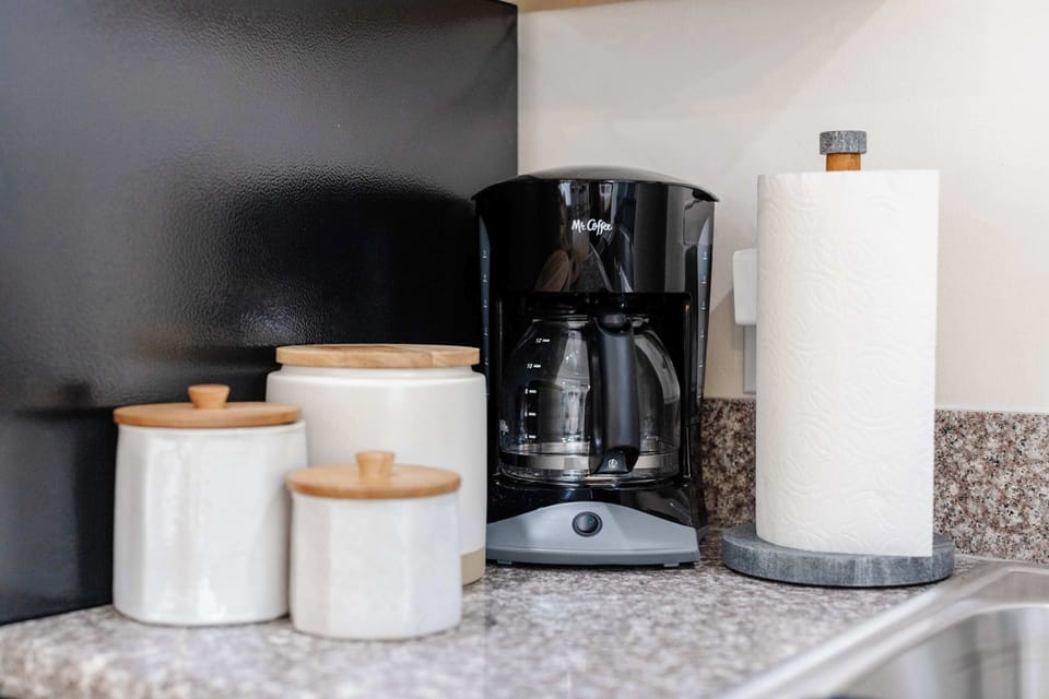 Coffee station with drip coffee maker and kitchen basics