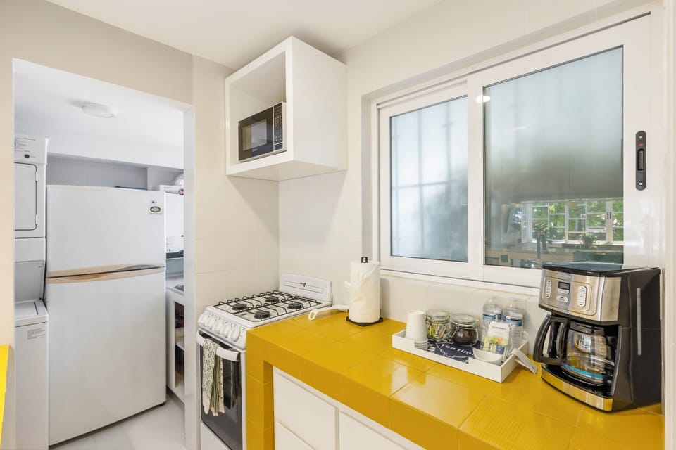 Comfort Condo | Private kitchen | Coffee/tea maker, toaster, blender, cleaning supplies