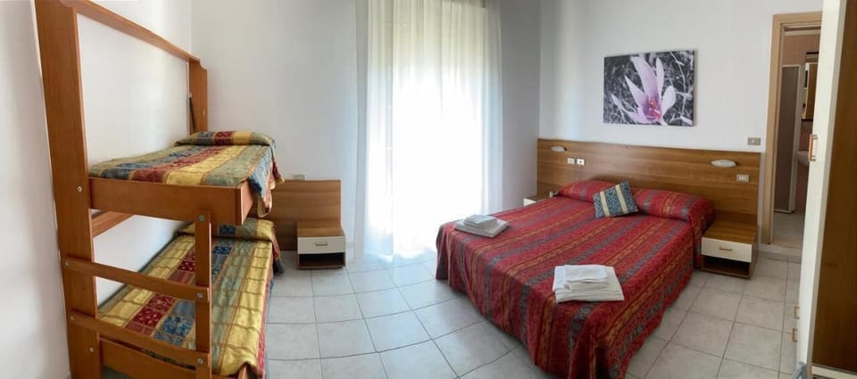 Comfort Quadruple Room, Patio, Sea View | Desk, blackout drapes, iron/ironing board, WiFi (free)