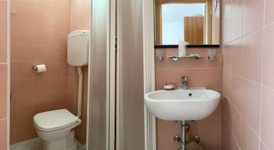 Shower, free toiletries, hair dryer, slippers