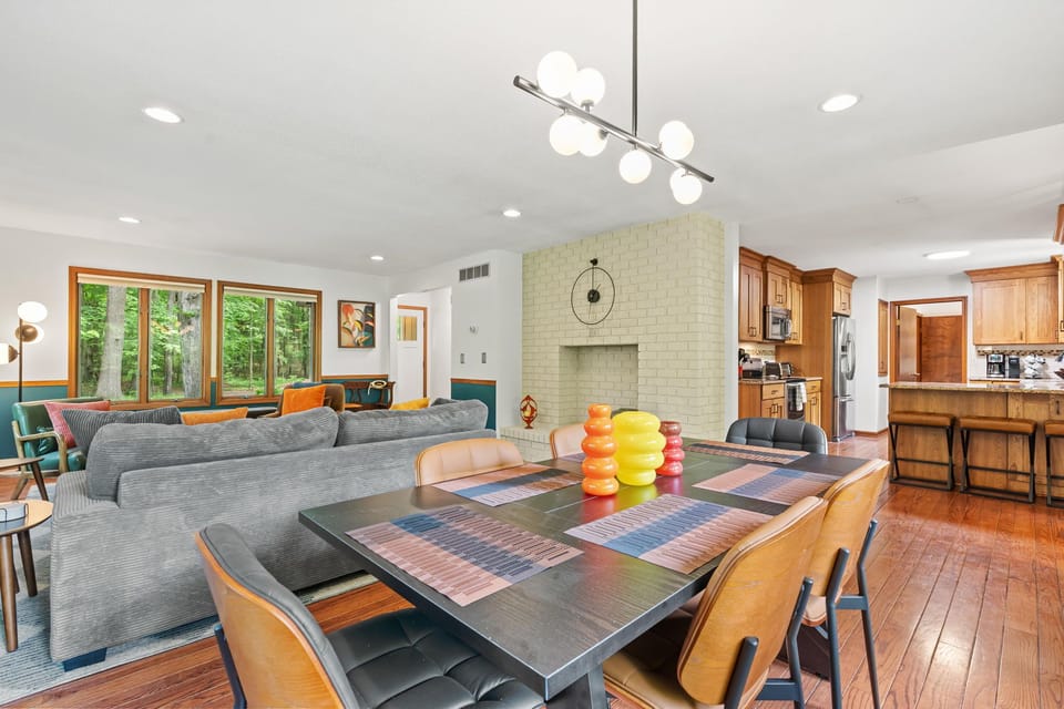 Bright open living space with wooded views and spacious kitchen