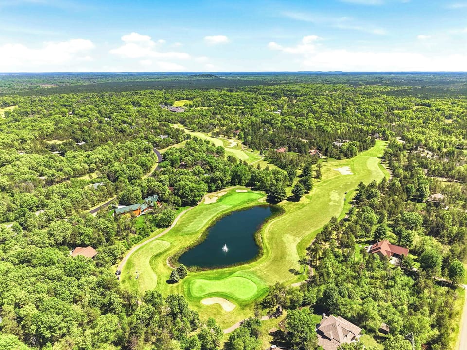 Tee off into a scenic escape surrounded by rolling fairways, sparkling water views, and endless treetop horizons.