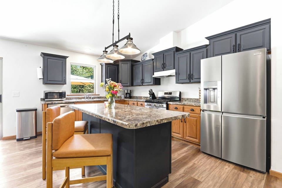 Enjoy cooking and gathering in a bright, well-appointed kitchen with generous island seating and an easy connection to the heart of the home.