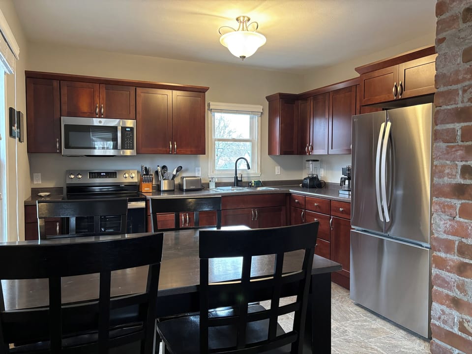 Stay in and utilize the upstairs unit's fully stocked kitchen