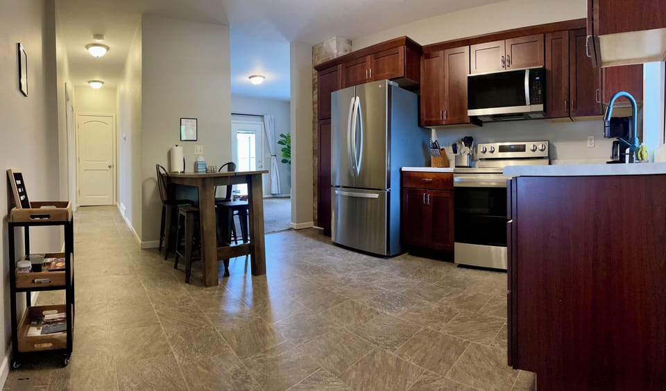 Enjoy a home-cooked meal in the downstairs unit's fully stocked kitchen