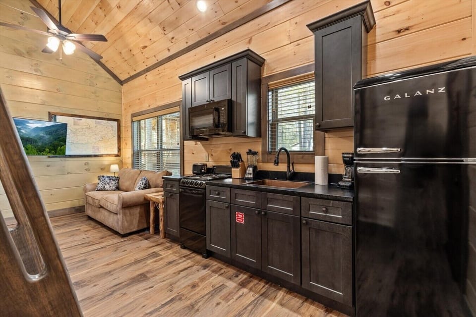 Full kitchen with stove, refrigerator, drip coffee maker