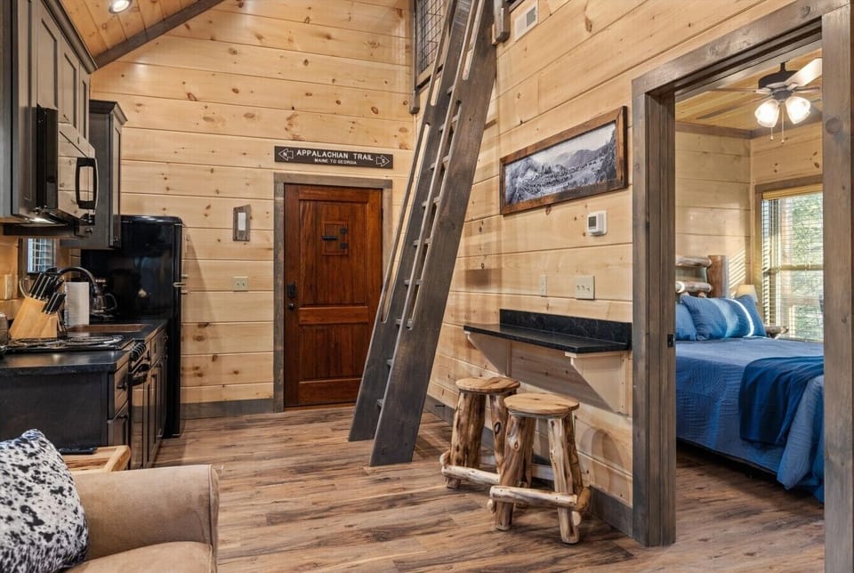 Kitchen and living area with loft ladder