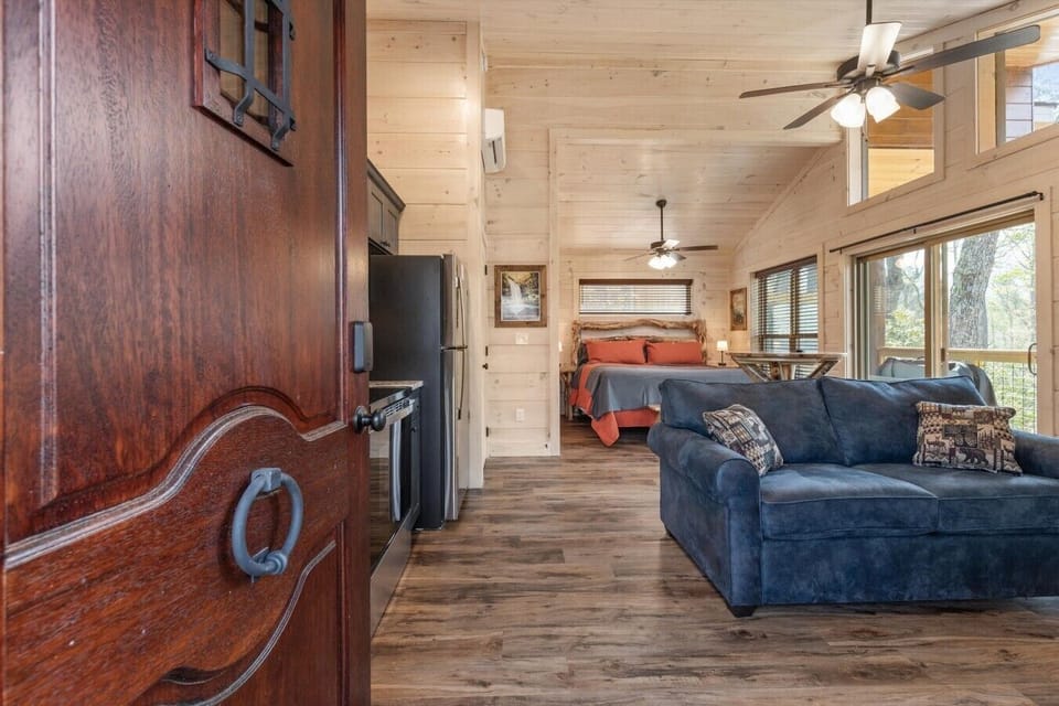 Living space with full kitchen, smart tv, dining, electric fireplace