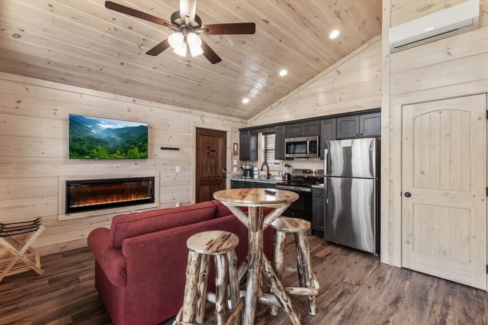 Living space with full kitchen, smart tv, dining, electric fireplace