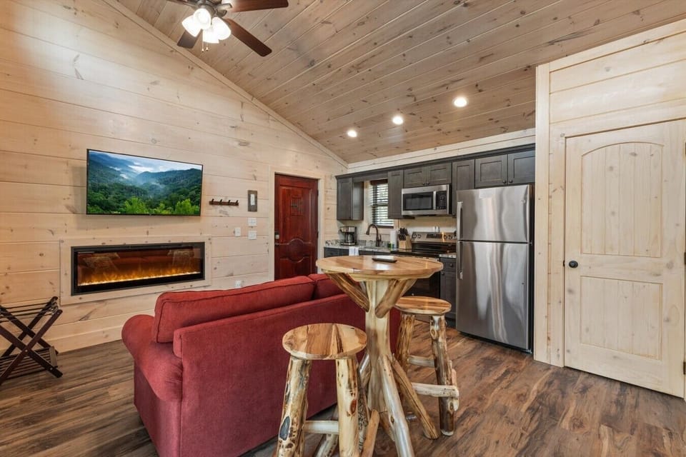 Living space with full kitchen, smart tv, dining, electric fireplace