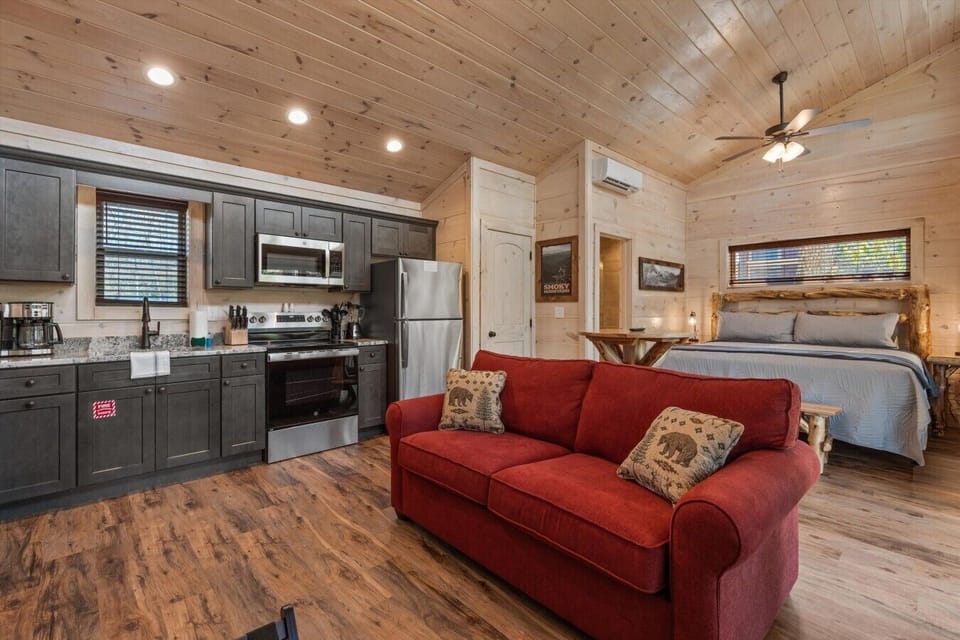 Living space with full kitchen, smart tv, dining, electric fireplace