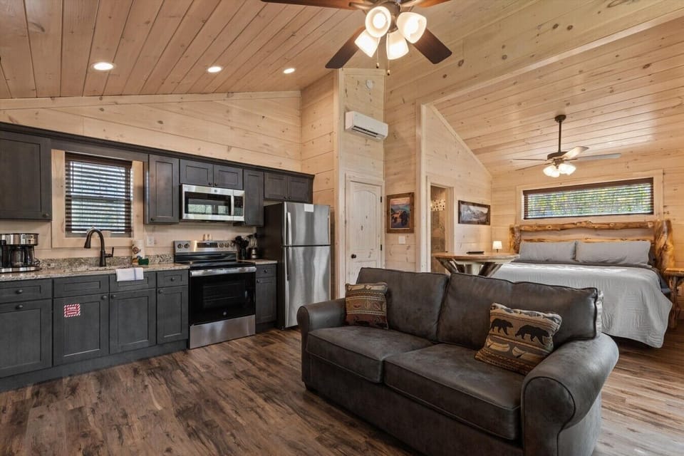 Living space with full kitchen, smart tv, dining, electric fireplace