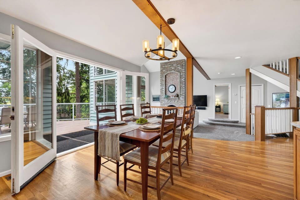Dining area with deck access, natural light, and an easy flow for indoor-outdoor meals.