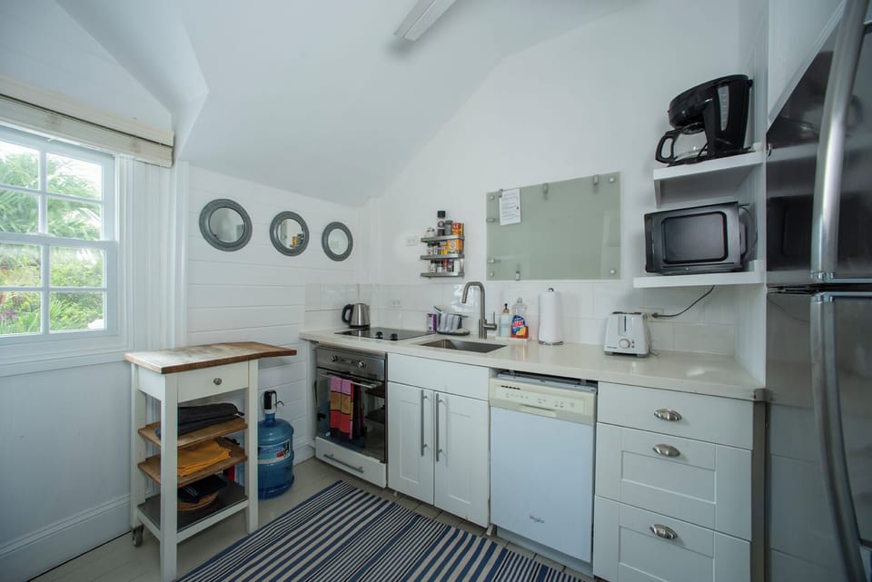The kitchen is fully equipped for cooking and dining.