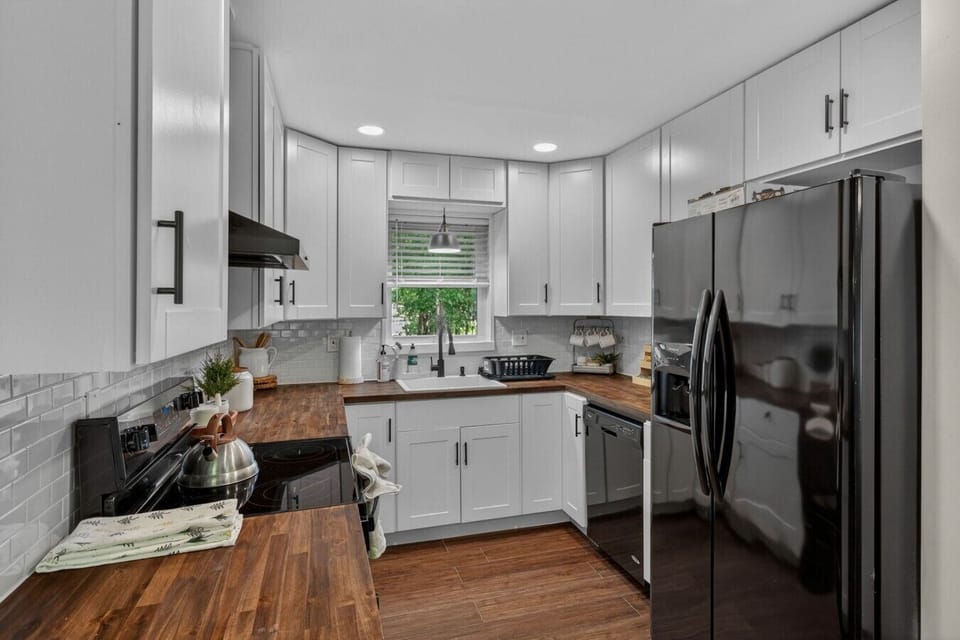 Updated kitchen with modern finishes, stainless appliances, and everything needed for home-cooked meals.