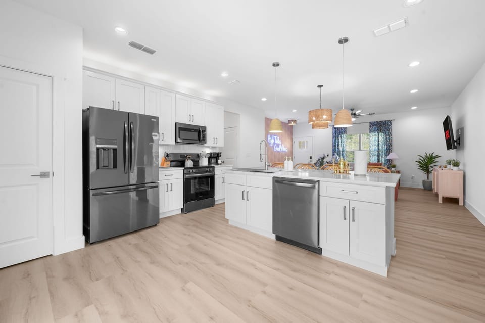Bright modern kitchen with large island and open-concept living space