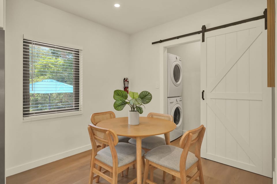 Laundry room, washer and drier, iron and board.